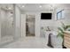 Sleek bathroom with a freestanding tub, a walk-in shower, and modern fixtures, creating a sophisticated and comfortable space at 7140 Palmyra Ave, Las Vegas, NV 89117