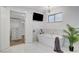 Bright bathroom with a soaking tub, closet, and modern lighting at 7140 Palmyra Ave, Las Vegas, NV 89117