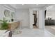 Spacious bathroom showcasing double vanity, walk-in closet, and seamless access to other rooms at 7140 Palmyra Ave, Las Vegas, NV 89117