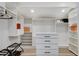 Spacious walk-in closet with custom shelving, drawer units, and ample storage for organized wardrobe management at 7140 Palmyra Ave, Las Vegas, NV 89117