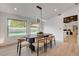 Bright dining room with modern lighting and views of the sparkling pool at 7140 Palmyra Ave, Las Vegas, NV 89117