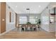 Bright dining room featuring sleek modern lighting, and views of the backyard at 7140 Palmyra Ave, Las Vegas, NV 89117