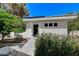 Home exterior features a stone accent wall and a well-maintained front yard at 7140 Palmyra Ave, Las Vegas, NV 89117