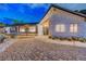 Beautiful single-story home with well-maintained desert landscaping, a stone facade, and modern garage at 7140 Palmyra Ave, Las Vegas, NV 89117