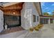 The front entrance has a custom door and stone accents that adds curb appeal to this home at 7140 Palmyra Ave, Las Vegas, NV 89117