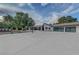 Expansive front yard featuring modern landscaping, a long driveway, and a basketball hoop, enhancing the home's curb appeal at 7140 Palmyra Ave, Las Vegas, NV 89117