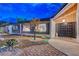 Inviting front yard with desert landscaping, stone accents, and charming exterior details at 7140 Palmyra Ave, Las Vegas, NV 89117