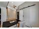 Bright home office showcasing a functional workspace and convenient access to the laundry at 7140 Palmyra Ave, Las Vegas, NV 89117