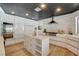Modern kitchen features stainless steel appliances, white cabinets, and a marble backsplash at 7140 Palmyra Ave, Las Vegas, NV 89117