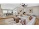 Spacious open-concept living room with views to the dining area, fireplace, and cozy seating at 7140 Palmyra Ave, Las Vegas, NV 89117