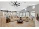 Open-concept living room flows into the kitchen, creating a perfect space for entertaining and modern living at 7140 Palmyra Ave, Las Vegas, NV 89117