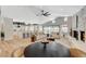 Spacious living room with open floor plan, fireplace and view into the kitchen at 7140 Palmyra Ave, Las Vegas, NV 89117