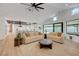 Cozy living room with stylish furniture and an open layout to the kitchen at 7140 Palmyra Ave, Las Vegas, NV 89117