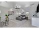 Stylish main bedroom features a gray color scheme, a ceiling fan, and a kitchenette at 7140 Palmyra Ave, Las Vegas, NV 89117