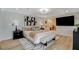 Spacious main bedroom with a modern design, a large bed, and an adjoining living area at 7140 Palmyra Ave, Las Vegas, NV 89117