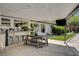 Relaxing covered outdoor patio with dining area and bar seating at 7140 Palmyra Ave, Las Vegas, NV 89117