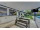 Covered patio with an outdoor dining area and a view of the pool at 7140 Palmyra Ave, Las Vegas, NV 89117