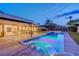Backyard pool featuring stylish lounge chairs, and an outdoor dining area at 7140 Palmyra Ave, Las Vegas, NV 89117