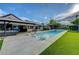 Backyard pool with lounge chairs and patio area for outdoor entertaining at 7140 Palmyra Ave, Las Vegas, NV 89117