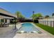 Inviting swimming pool with sun loungers and lush landscaping at 7140 Palmyra Ave, Las Vegas, NV 89117