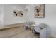 Cozy sitting area with comfortable chairs and modern art at 7140 Palmyra Ave, Las Vegas, NV 89117