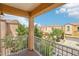 Outdoor balcony featuring a metal railing and neighborhood views at 7331 Carrot Ridge St, Las Vegas, NV 89139