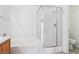 Bright bathroom with a separate tub and shower featuring glass door at 7331 Carrot Ridge St, Las Vegas, NV 89139