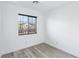 Clean bedroom featuring wood floors and a window with stylish blinds at 7331 Carrot Ridge St, Las Vegas, NV 89139