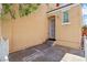 Side view of a front entrance featuring a secured doorway and small yard at 7331 Carrot Ridge St, Las Vegas, NV 89139