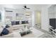 Cozy living room with stylish decor, plush seating, and marble tile floors at 7331 Carrot Ridge St, Las Vegas, NV 89139