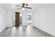 Spacious living room with wood floors and a sliding door to a patio at 7331 Carrot Ridge St, Las Vegas, NV 89139