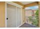 Cozy outdoor patio with sliding screen doors and metal railing at 7331 Carrot Ridge St, Las Vegas, NV 89139