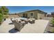 Spacious backyard with a patio area, fire pit, and beautiful landscaping at 7340 Zonal Ave, Las Vegas, NV 89131