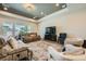 Spacious living room with recessed lighting, large windows, and comfortable neutral-toned furniture at 7340 Zonal Ave, Las Vegas, NV 89131