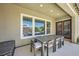 Covered patio boasts an outdoor dining set and view of the backyard at 7340 Zonal Ave, Las Vegas, NV 89131