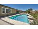 Inviting backyard pool area with lounge seating and a patio dining set at 7340 Zonal Ave, Las Vegas, NV 89131