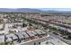 A residential neighborhood with modern homes and a mix of desert landscaping and mature trees at 7416 Deschutes Cir, Las Vegas, NV 89129