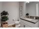 Stylish powder room featuring a modern vanity, framed art and attractive lighting at 7416 Deschutes Cir, Las Vegas, NV 89129