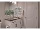 This bathroom includes a modern vanity, and a large mirror for a bright and open feel at 7416 Deschutes Cir, Las Vegas, NV 89129