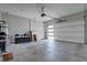 Spacious two-car garage with concrete flooring and white door, providing ample room for vehicles and storage at 7416 Deschutes Cir, Las Vegas, NV 89129