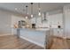 Modern kitchen with white cabinets, stainless steel appliances, a subway tile backsplash, and marble countertops at 7416 Deschutes Cir, Las Vegas, NV 89129
