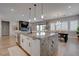 Open-concept design with kitchen island overlooking the dining and living areas; great for entertaining at 7416 Deschutes Cir, Las Vegas, NV 89129