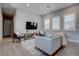 This living room offers a comfortable seating area with large windows for ample natural light at 7416 Deschutes Cir, Las Vegas, NV 89129