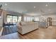 Bright, open-concept living space with wood floors and modern decor at 7416 Deschutes Cir, Las Vegas, NV 89129