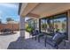 Comfortable covered patio featuring paved flooring, modern outdoor furniture, and beautiful views of the backyard at 7416 Deschutes Cir, Las Vegas, NV 89129