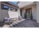Welcoming patio with modern seating and stylish front door at 7416 Deschutes Cir, Las Vegas, NV 89129