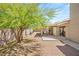 Private backyard with a covered patio, perfect for relaxing or entertaining in the desert landscaped yard at 7736 Foredawn Dr, Las Vegas, NV 89123