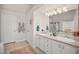 Bathroom features dual sinks with ample counter space and modern lighting at 7736 Foredawn Dr, Las Vegas, NV 89123