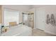 Bright bathroom features a soaking tub and separate shower with gold trim at 7736 Foredawn Dr, Las Vegas, NV 89123