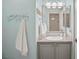 Charming bathroom features granite countertops, a towel rack, and a large framed mirror at 7736 Foredawn Dr, Las Vegas, NV 89123